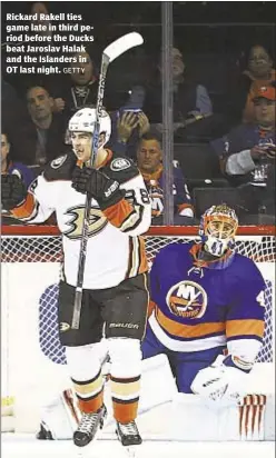  ?? GETTY ?? Rickard Rakell ties game late in third period before the Ducks beat Jaroslav Halak and the Islanders in OT last night.