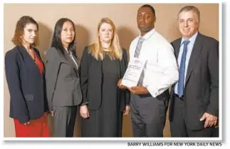  ?? BARRY WILLIAMS FOR NEW YORK DAILY NEWS ?? Michael Robinson (second from right), who spent 26 years in prison, is still fighting along with his legal team, to have his name cleared, citing new DNA evidence.