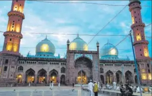  ??  ?? In old Bhopal, the walk starts at the Taj-ulMasjid, the country’s largest mosque.(Below left) As with the saltysweet breakfast of poha-jalebi, Bhopal’s special falahar is also a mix of sweet and savoury, from sabudana chivda and mawa jalebi to besan laddoo and balushahi.