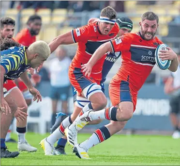  ?? ?? Edinburgh’s Adam McBurney charges for the line in Parma yesterday