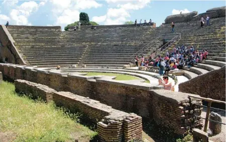  ?? RICK STEVES ?? The show still goes on in ancient Ostia’s theater. One of the oldest brick theaters anywhere, it’s still used for concerts today.