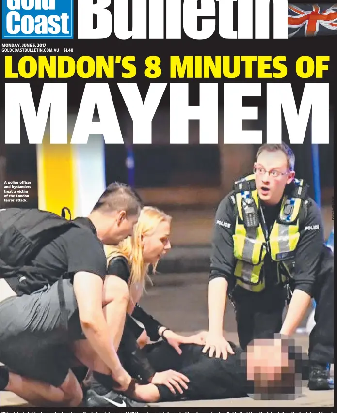  ??  ?? A police officer and bystanders treat a victim of the London terror attack.