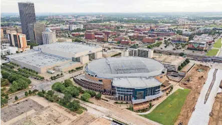  ?? [PHOTO BY DAVE MORRIS, THE OKLAHOMAN] ?? The Oklahoma City Urban Renewal Authority is set to solicit developmen­t proposals for a stretch of land between the Chesapeake Energy Arena and the Oklahoma City Boulevard, shown at right.
