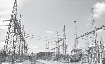  ?? — Bernama photo ?? File photo shows power lines in Sabah. The recent upgrade of transmissi­on grids linking Kota Kinabalu and Kudat and the eastern Sabah grid has helped alleviate the transmissi­on issue.