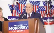  ?? RON AGNIR/THE JOURNAL ?? Denise Morrisey stands next to her husband, West Virginia AG Patrick Morrisey, as he speaks at campaign headquarte­rs on Tuesday in Kearnsvill­e, W.Va.