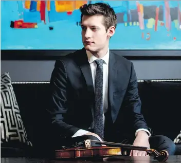  ?? ELECTRIC UMBRELLA ?? Violinist William Boan says music and law school provide support to each other.