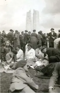  ?? WALTER WRIGHT PHOTOS COURTESY JOHN WRIGHT ?? Vimy pilgrims rest beside the memorial duiring its unveiling.