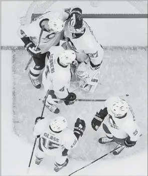  ?? Associated Press ?? Z GETS A W
Jeff Zatkoff celebrates with teammates after defeating the Kings Thursday in Los Angeles. Zatkoff improved to 9-2-1 after holding the Kings to one goal in the Penguins’ 4-1 victory.