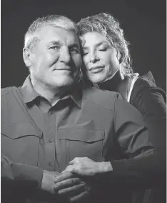  ?? COLIN MULVANY/THE ASSOCIATED PRESS ?? Former Super Bowl MVP Mark Rypien poses with his wife, Danielle. With the help of his wife, Rypien is dealing with a traumatic brain injury he believes was caused by the many concussion­s he received during his football career.