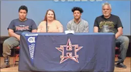  ?? Michelle Petteys, Heritage Snapshots ?? Antwaun Powell was joined by his family, as well as teammates, coaches and friends, as he signed papers to continue his track career with Covenant College this past Wednesday.