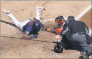  ?? JIM MONE — THE ASSOCIATED PRESS ?? Minnesota Twins’ Luis Arraez, left, is tagged out by Houston Astros catcher Martin Maldonado as he attempted to score on a Marwin Gonzalez single in the fifth inning of Wednesday’s game in Minnesota.