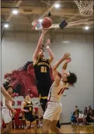  ?? PAUL DICICCO — FOR THE NEWS-HERALD ?? Beachwood’s Noah Page shoots over a Perry defender.