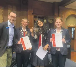  ?? ?? Palmerston North Girls’ High School won the central North Island schools debating competitio­n. Team members are Ester Steer, right, Pari Rao and Hallie Williamson, along with Whanganui MP Carl Bates.