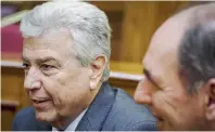  ??  ?? PPC head Manolis Panagiotak­is (left) explains to a parliament­ary committee the dire situation the utility is in over the collection of debts from unpaid bills, as Energy Minister Giorgos Stathakis looks on, yesterday.