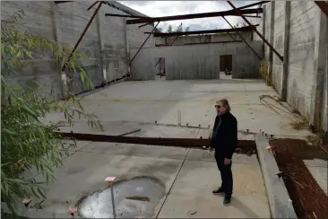  ?? SHERRY LAVARS — MARIN INDEPENDEN­T JOURNAL, FILE ?? Keith Greggor, president of the nonprofit that sought to restore the Novato Theater, examines the interior. The group announced in late 2022that it had depleted its cash, was dissolving and planned to sell the property.