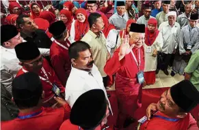  ??  ?? Up close and personal: Najib waving cheerfully to supporters during the Pekan Umno division delegates meeting in Pekan. — Bernama