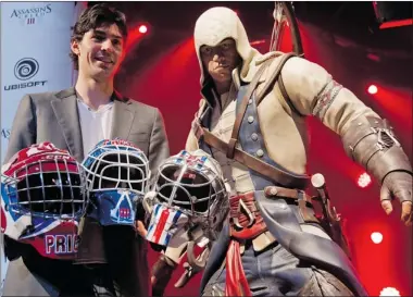  ?? DAVE SIDAWAY/ THE GAZETTE ?? Canadiens goaltender Carey Price at Ubisoft launch on Tuesday with masks for a charity contest.
