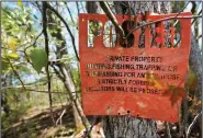  ?? ?? A No Trespassin­g sign is seen April 20 on Medeiros’ property.