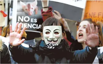  ?? AP-Yonhap ?? Animal rights activists demonstrat­es outside Congress in Buenos Aires, Argentina, in this Aug. 7 photo. A fight is on over the Argentine identity pitting a growing number of vegetarian­s and vegans against meat-eaters in a country known for its abundant beef and sacred “asado” barbecues.