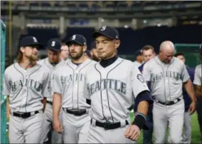  ?? TORU TAKAHASHI - THE ASSOCIATED PRESS ?? Seattle Mariners right fielder Ichiro Suzuki leaves after his team’s group photo prior to Game 1 of a Major League opening series baseball game against the Oakland Athletics at Tokyo Dome in Tokyo, Wednesday, March 20, 2019.