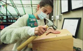  ?? Erik Trautmann / Hearst Connecticu­t Media ?? Leighton Murphy of Girl Scouts Troop 50398 builds a bat box for a project with the Rowayton Gardeners Friday.