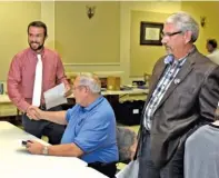  ?? STAFF PHOTO BY TIM BARBER ?? Ringgold mayoral candidates Nick Millwood, left, and Tony Hullender, right, surround re-elected City Councilman Terry Crawford. Millwood and Hullender face a runoff on Dec. 1.