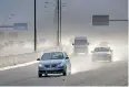  ?? African News Agency (ANA) ?? MOTOR vehicles driving on the R300 highway just after a hard rainstorm. | ARMAND HOUGH