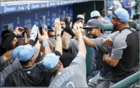  ?? CHRIS SZAGOLA — THE ASSOCIATED PRESS ?? The Arizona Diamondbac­ks’ Reymond Fuentes celebrates his home run with teammates during the 10th inning of a baseball game against the Philadelph­ia Phillies, Sunday in Philadelph­ia.