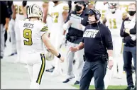  ??  ?? New Orleans Saints head coach Sean Payton speaks with quarterbac­k Drew Brees (9) during the first half of an NFL football game
against the Las Vegas Raiders on Sept 21, in Las Vegas. (AP)