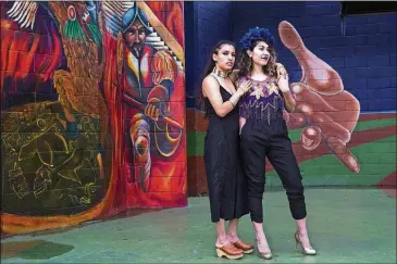  ??  ?? Madeline Casas, left, and Shavone Otero are both influenced by 1940s pachuca style, but they describe the overall look of the Austin chapter of Chulita Vinyl Club as eclectic. “We have a lot of women from Latin America. We have pretty diverse styles,”...