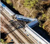  ?? JEFF BLAKE / ASSOCIATED PRESS ?? The site of Sunday’s earlymorni­ng train crash between an Amtrak train ( bottom) and a CSX freight train in Cayce, S. C. TheAmtrak train was going an estimated 59mph when it struck the freight train.