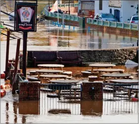  ??  ?? DELUGE: A pub beer garden in Upton-upon-Severn, Worcesters­hire, yesterday