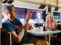  ??  ?? Chip Litchfield, left, and Penni Brink are travelling the United States in their RV, picking up jobs along the way to earn a little money.