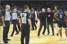  ?? AP photo ?? Philadelph­ia coach Nick Nurse is held back as he argues with officials after the 76ers lost to the Los Angeles Clippers on Wednesday.