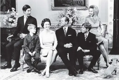  ??  ?? Nov. 20, 1972: The Queen and Prince Philip are surrounded by their family in Buckingham Palace on the occasion of the royal couple’s silver wedding anniversar­y. From left: Prince Charles (age 24), Prince Edward, the youngest child (age eight), the Queen, Prince Philip, Prince Andrew (age 12) and Princess Anne (age 22).