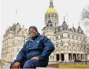  ?? Ned Gerard/Hearst Connecticu­t Media ?? Mack Young smiles on the grounds of the state Capitol in Hartford last week. Young was released from state prison last year after serving nearly 30 years for a 1995 homicide conviction.