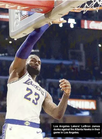  ?? AP ?? Los Angeles Lakers’ LeBron James dunks against the Atlanta Hawks in their game in Los Angeles.