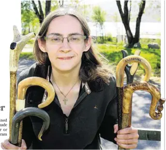  ??  ?? BY HOOK OR BY CROOK: Heather Gibson with her handcrafte­d walking sticks