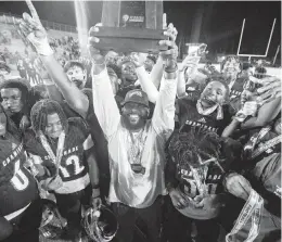  ?? A. WALLACE For the Miami Herald ?? Chaminade-Madonna coaches and players celebrate their win over Clearwater Central Catholic for the Class 1M championsh­ip at Gene Cox Stadium in Tallahasse­e.