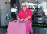  ??  ?? Doug Boyde, owner of Century 21 Rural &amp; Residentia­l (Huntly), paints a pretty picture selling raffle tickets in front of his office on the main drag, dressed in a pink polo shirt and wearing pink sunglasses.