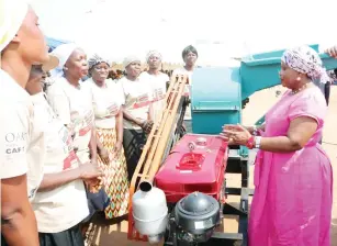  ?? ?? AGRIC4SHE patron First Lady Dr Auxillia Mnangagwa donated a grinding machine and other farming implements to women who are running a thriving garden in Rushinga