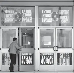  ?? Charles Krupa/AP ?? Store: A customer enters a Bon Ton store, which is scheduled to close, in Concord, N.H. Shoppers need to compare prices as they navigate the sales racks, and carefully check the quality of the merchandis­e since they can’t return items.