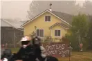  ?? Photograph: Robyn Beck/AFP/Getty Images ?? A sign reads ‘Looters Get Shot’ outside a residence in Molalla, Oregon, on Sunday.