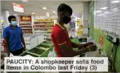  ??  ?? UCITY: A shop eper ells food item in ombo ast Friday 3)