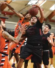  ?? RECORDER PHOTOS BY CHIEKO HARA ?? Portervill­e College's Tevin Howell, right, battles for the rebound Saturday, Jan. 20, during the second half at Portervill­e College.