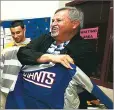  ?? NEW MEXICAN FILE PHOTO ?? Ron Shirley shows off a New York Giants jacket he received at his retirement party in 2006.