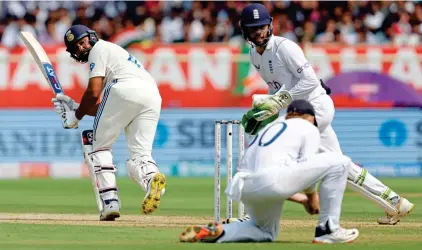  ?? REUTERS ?? Look back in anger: Sharma is caught by Pope, giving Bashir a memorable first Test wicket