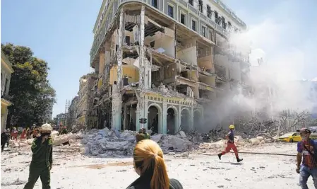  ?? RAMON ESPINOSA AP ?? Rooms are exposed at the five-star Hotel Saratoga after a deadly explosion Friday in Old Havana, Cuba. At least 22 people were killed.