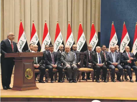  ?? Reuters ?? Iraqi Prime Minister Adel Abdul Mahdi announces his new cabinet to parliament in Baghdad after representa­tives accepted 14 of his 22 nomination­s, giving him enough ministers to be sworn in and convene his government, but with some key posts still undecided