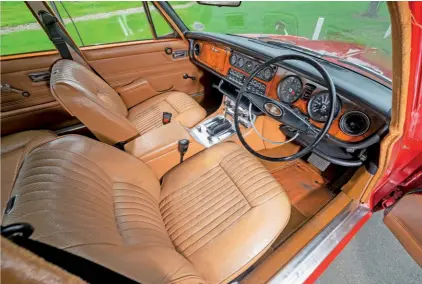  ??  ?? Despite its gloriously brash red exterior, the interior of this XJ6 features the typical Jaguar understate­d class and quality. Owner Vaughn loves the feel of the finger-light power steering through the thin-rimmed wheel.